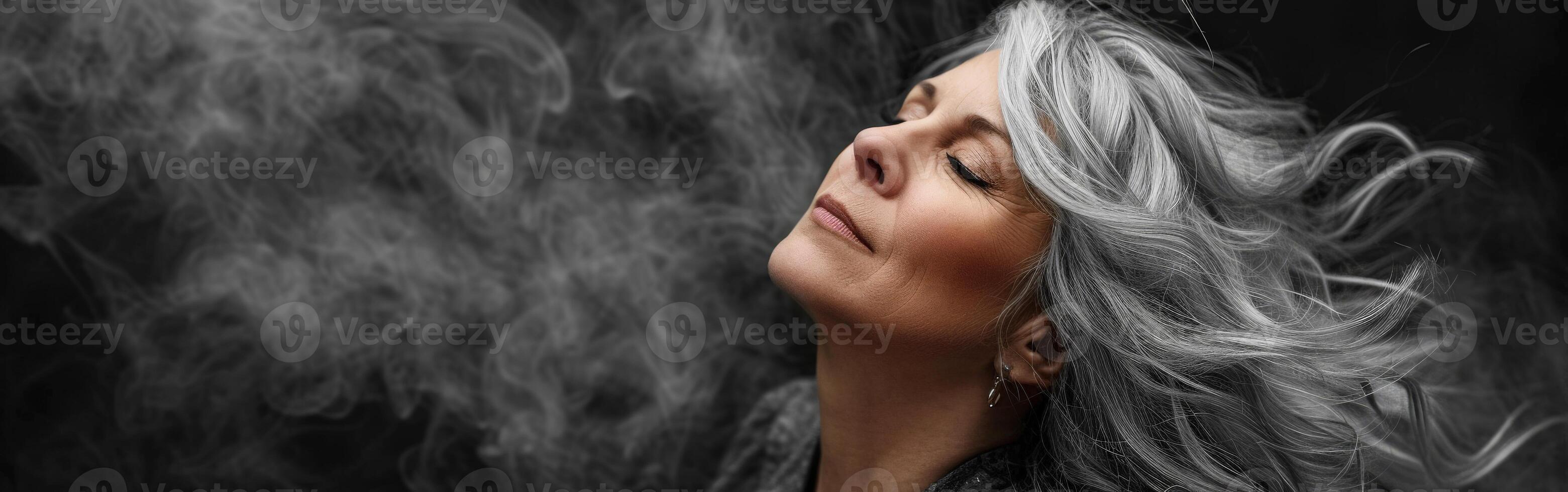 Woman With Closed Eyes Surrounded by Smoke photo