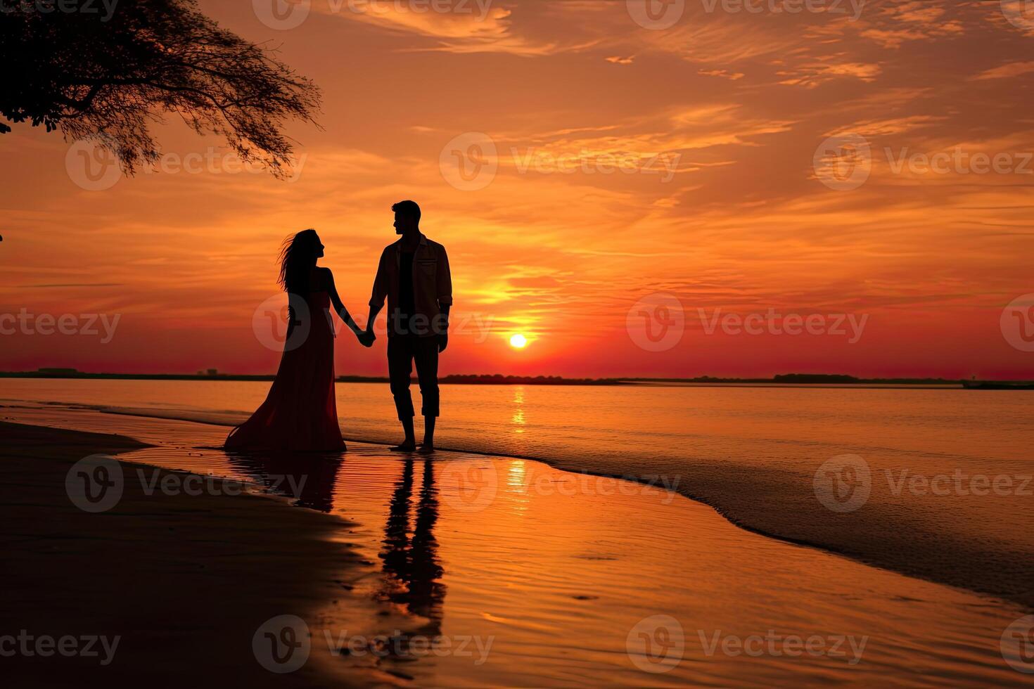Man and Woman Holding Hands on Beach at Sunset photo