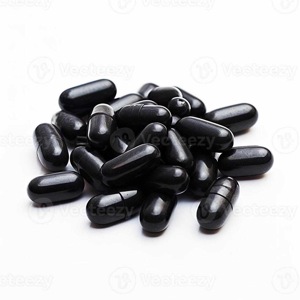 Stack of Black Pills on White Surface photo