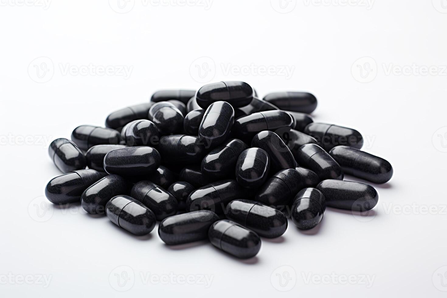Pile of Black Pills on White Table photo
