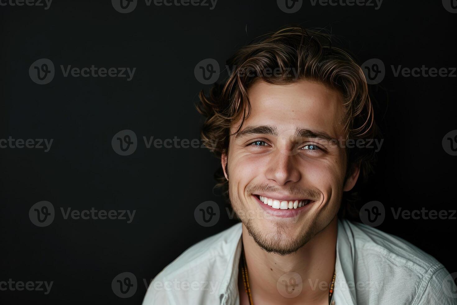 Smiling Man in White Shirt photo