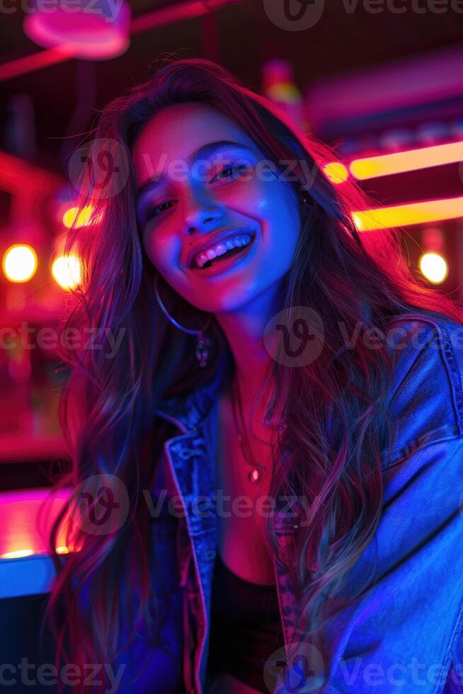 Woman Smiling in Neon Lights at a Bar photo