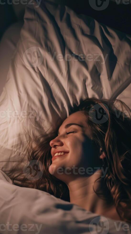 Woman Sleeping Happily in Bed photo