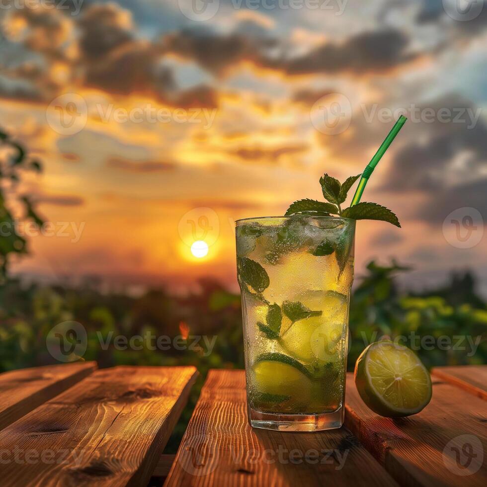 Multicolored bright cocktail with straw in a glass close up with ice cube and mint photo