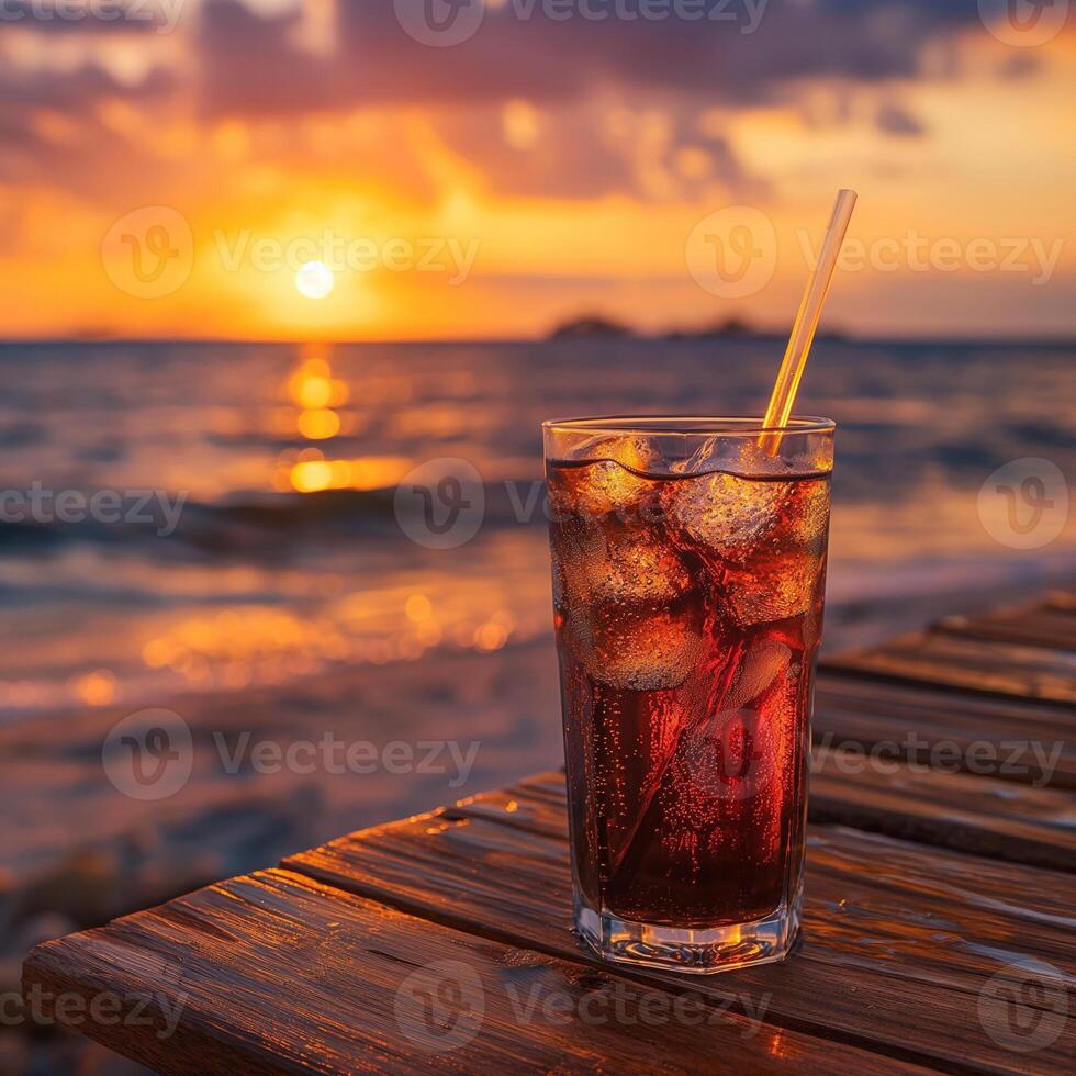Multicolored bright cocktail with straw in a glass close up with ice cube and mint photo