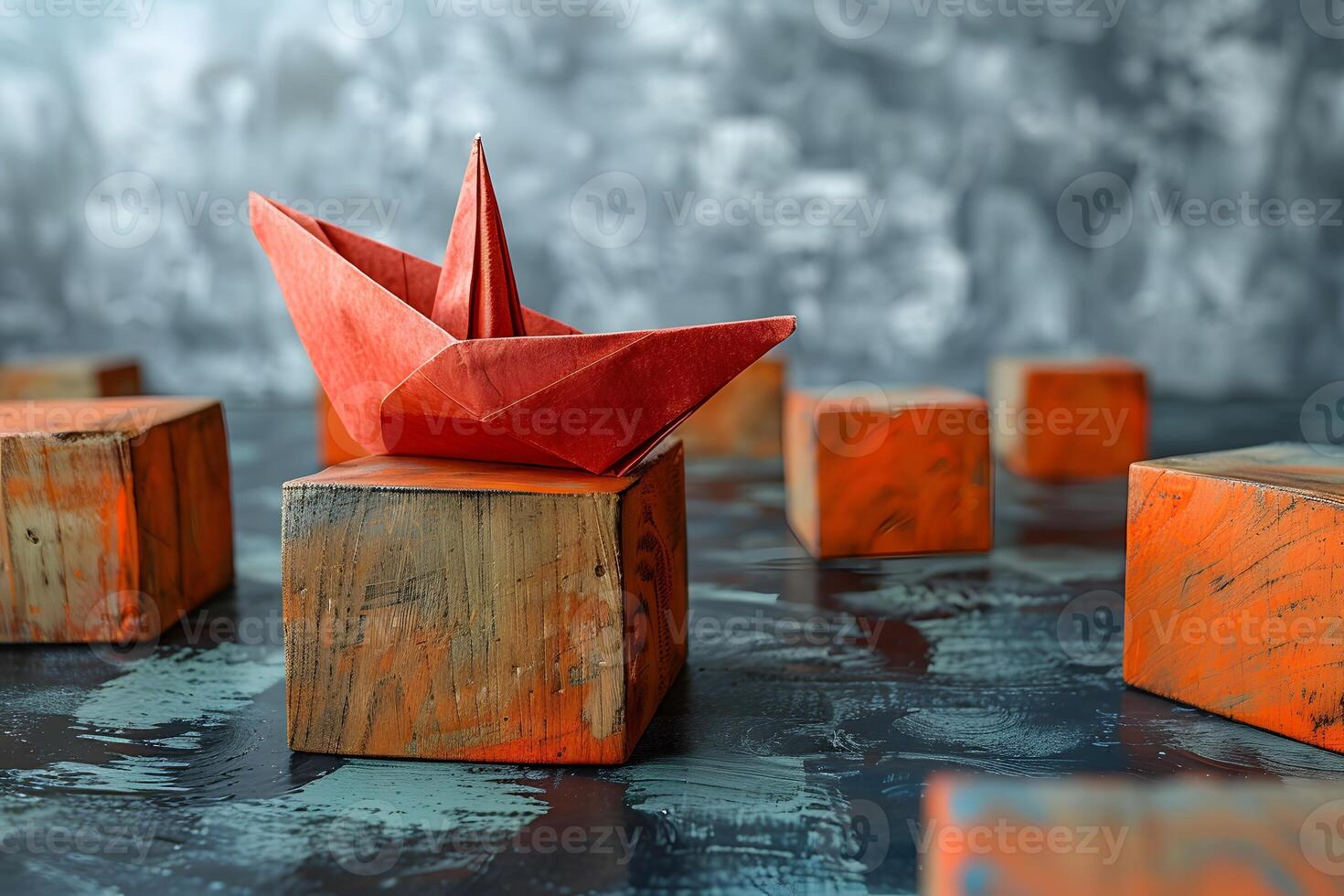 Origami Boat on Painted Wooden Blocks in Abstract Artistic Setting photo