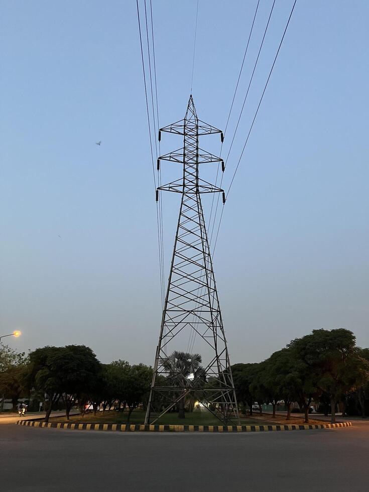 Transmission Lines and tower for transmitting electricity in Lahore, Pakistan on June 4, 2024. photo