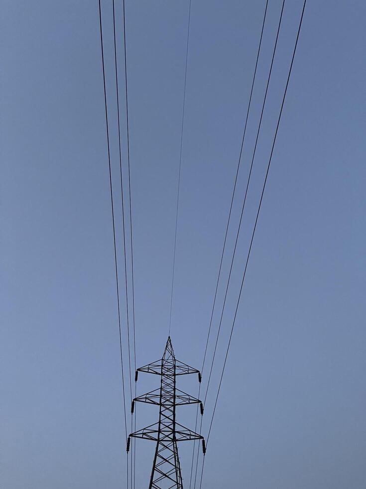 Transmission Lines and tower for transmitting electricity in Lahore, Pakistan on June 4, 2024. photo