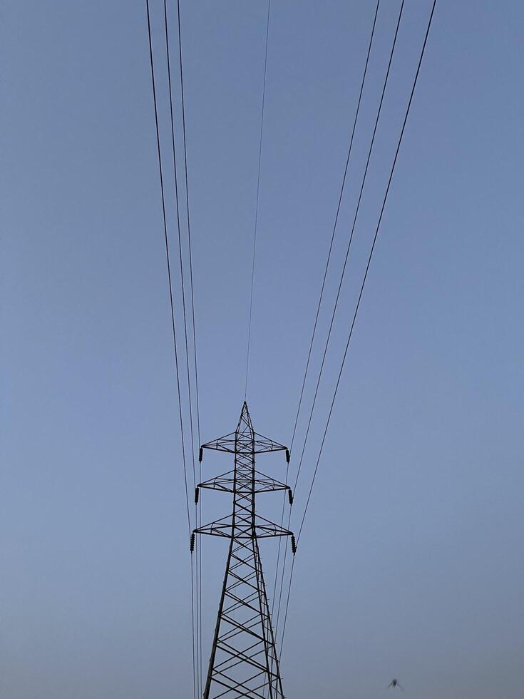 Transmission Lines and tower for transmitting electricity in Lahore, Pakistan on June 4, 2024. photo