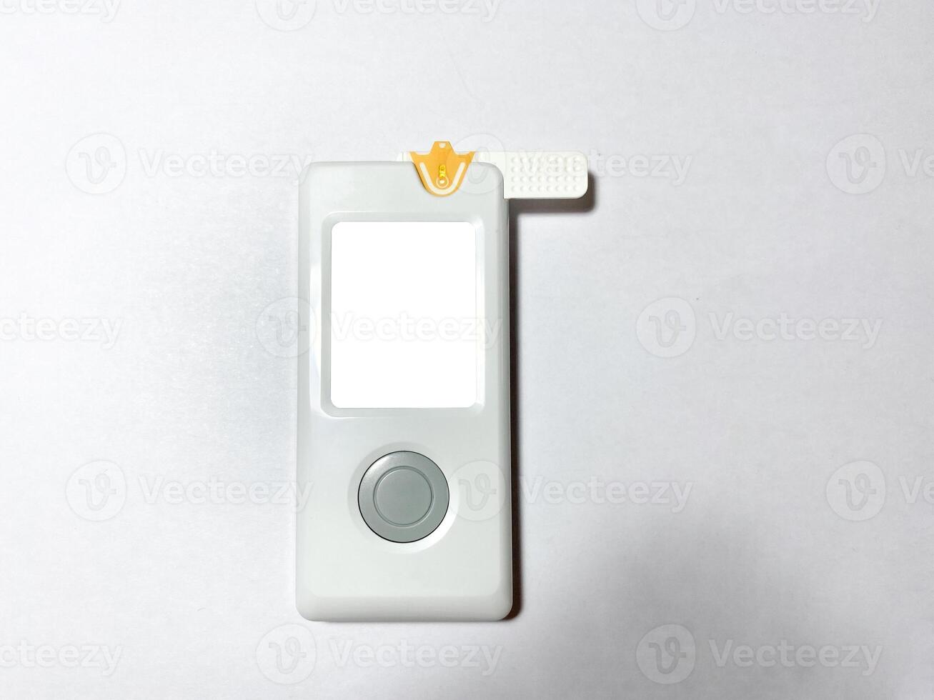 Measurement of blood sugar levels using a glucose meter with a mock-up. Piercing a finger to draw blood photo