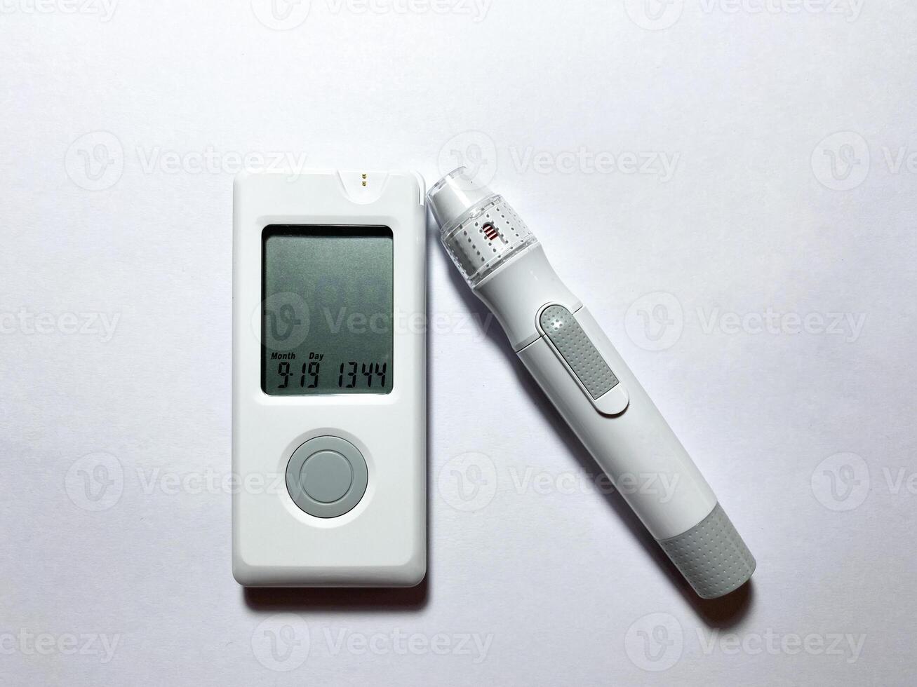 Measurement of blood sugar levels using a glucose meter with a mock-up. Piercing a finger to draw blood photo