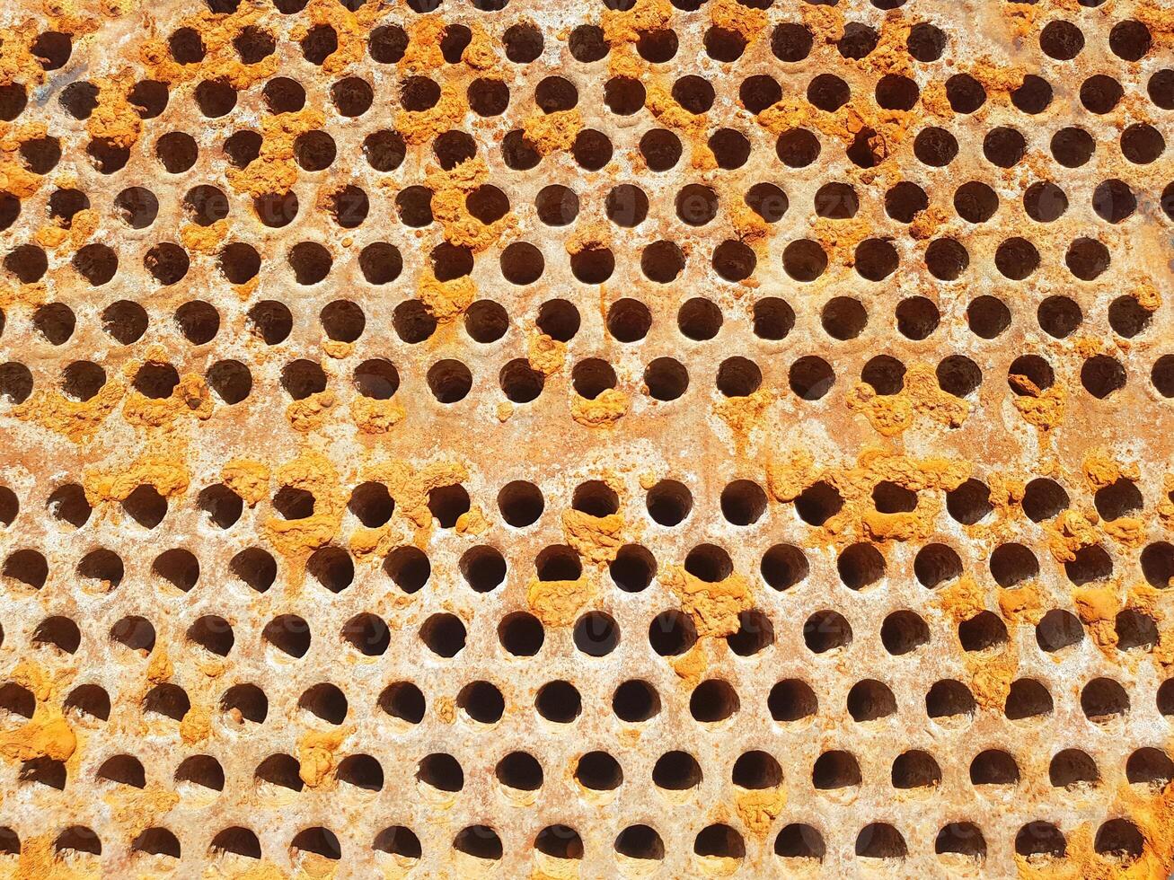 Shell-and-tube heat exchanger for heat exchange between two streams close-up. Dirty pipes in the opened heat exchanger photo