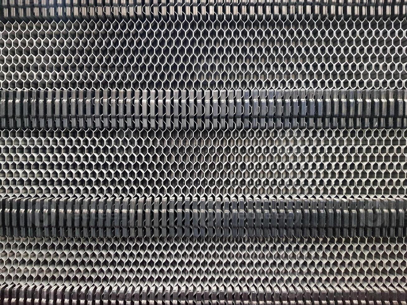 Background of the plate heat exchanger radiator grille Plate heat exchanger for heat transfer from a hot heat carrier to a cold medium photo