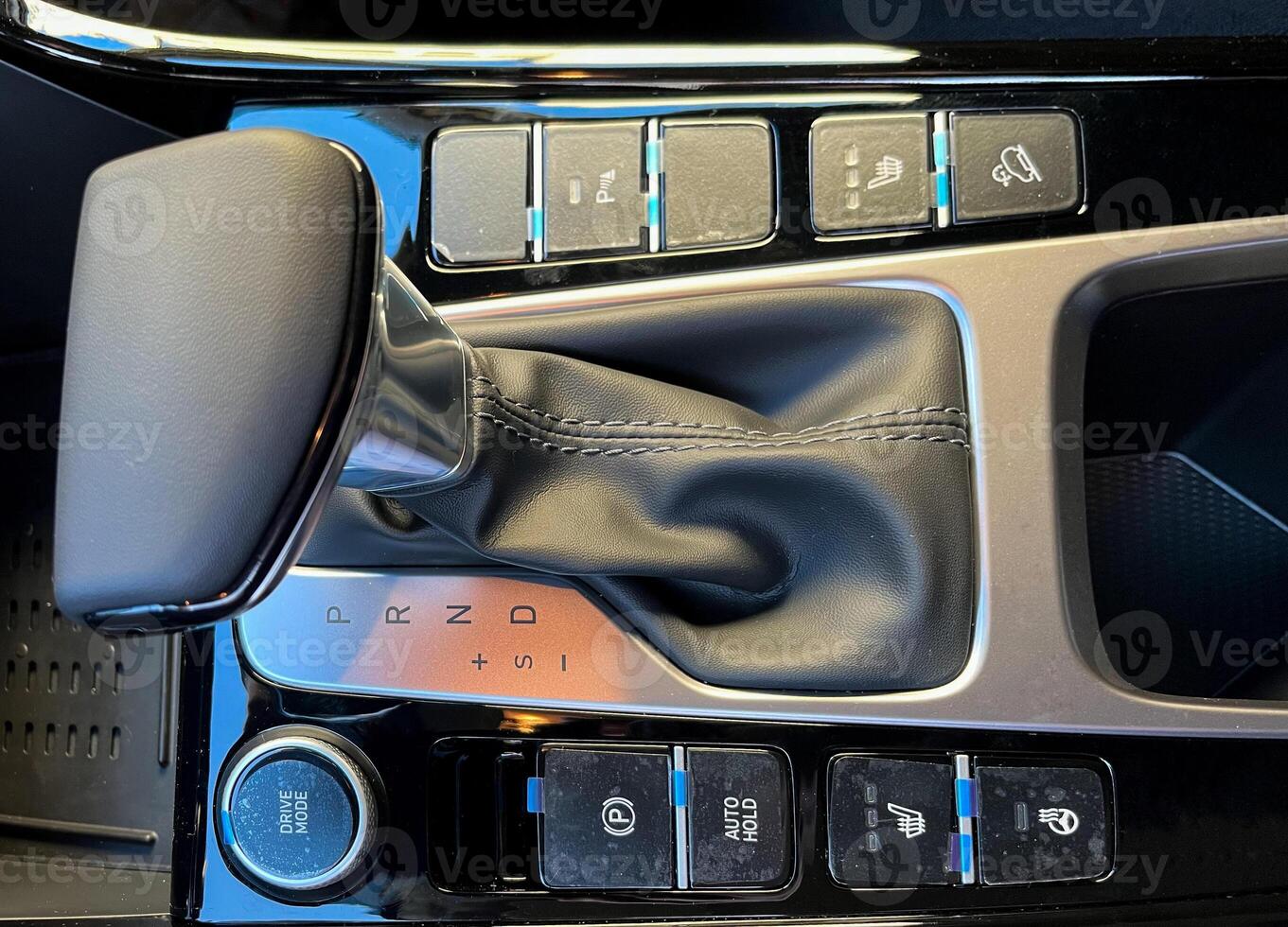 The interior of a new car. Automatic transmission in leather trim photo