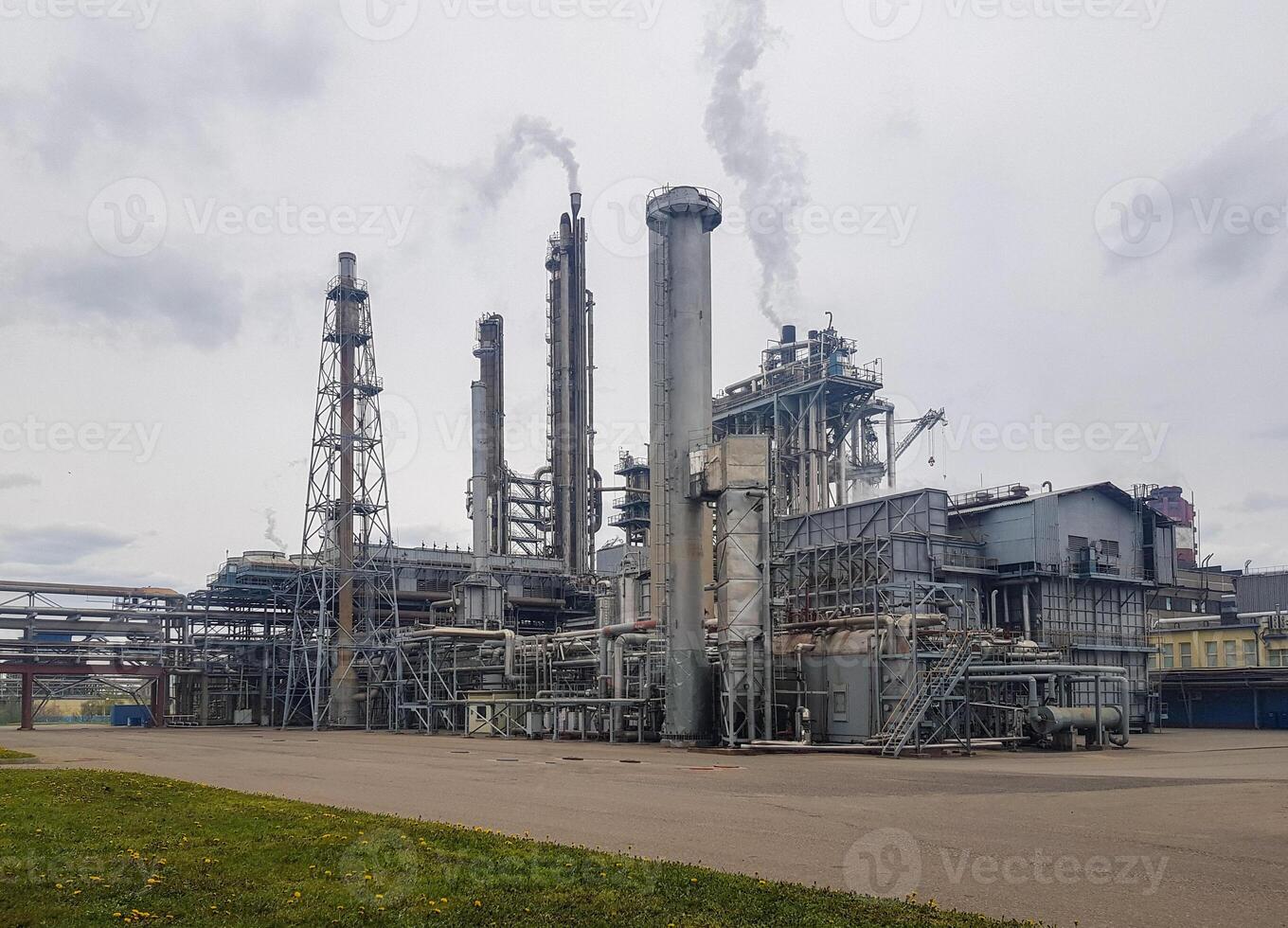 Large-capacity workshop for the production of ammonia of a petrochemical plant. The outer part of the tube furnace, shaft converter, CO2 absorber with copy space. Ammonia workshop under heavy polluted photo
