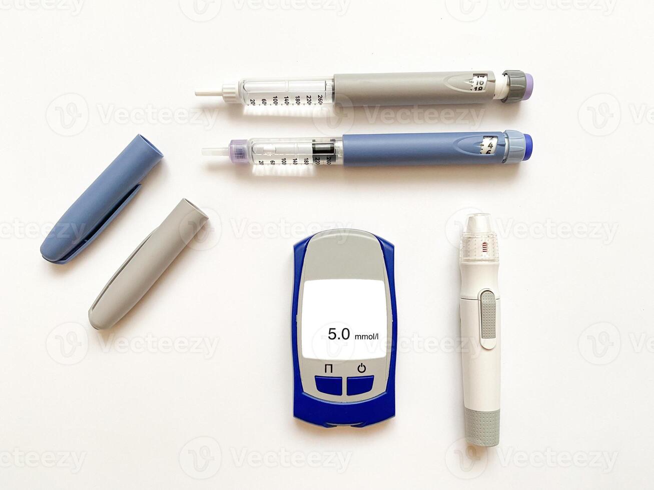 Insulin short, long, glucose meter, test strips and finger piercing pen on a white isolated background. Set for diabetics with mock up photo