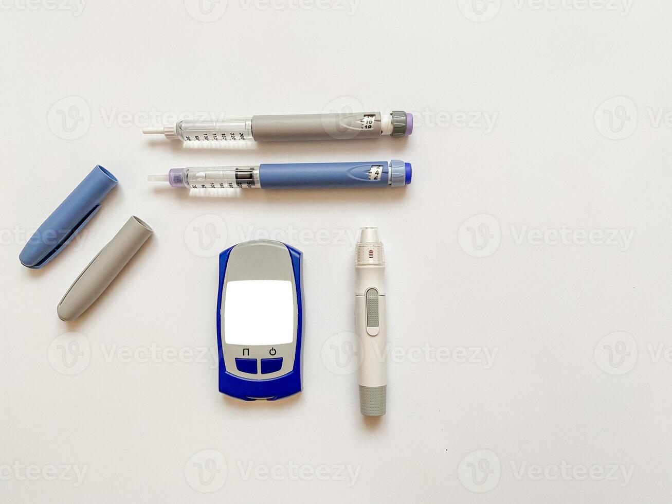 Insulin short, long, glucose meter, test strips and finger piercing pen on a white isolated background. Set for diabetics with mock up photo