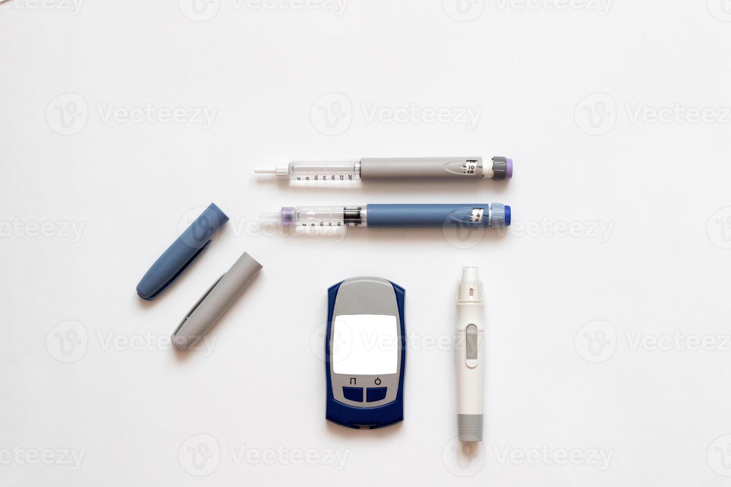 Insulin short, long, glucose meter, test strips and finger piercing pen on a white isolated background. Set for diabetics with mock up photo