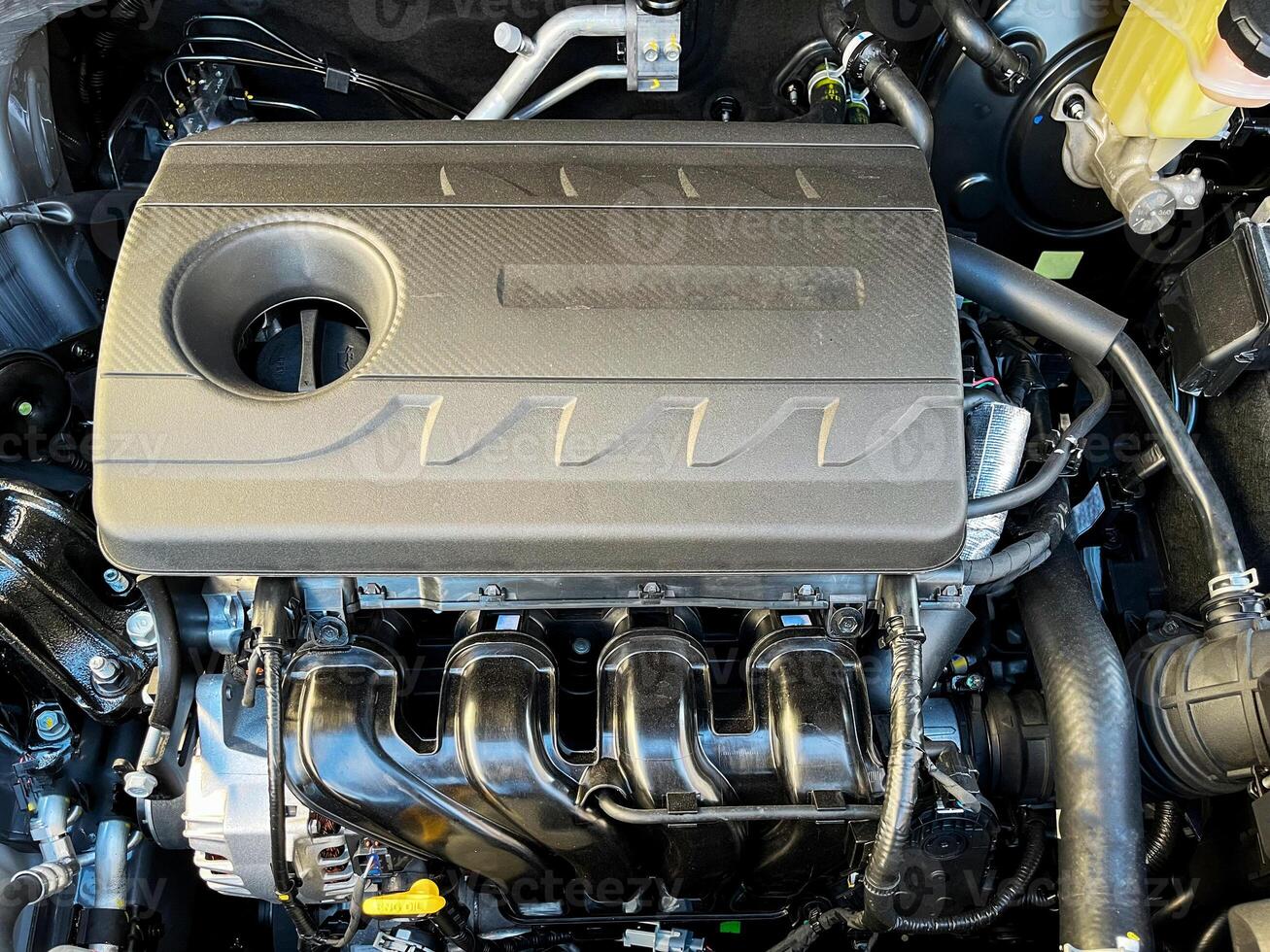 The engine compartment of the car, a view of the engine. Four-cylinder engine photo