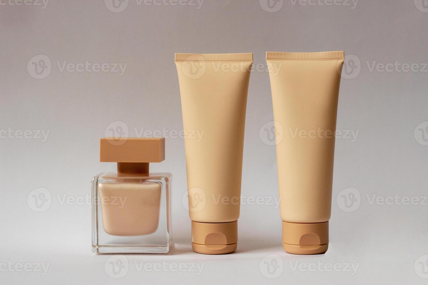 Close-up of a set of perfumed water, cream-colored shower gel in a gift box . Close-up photo on a white background