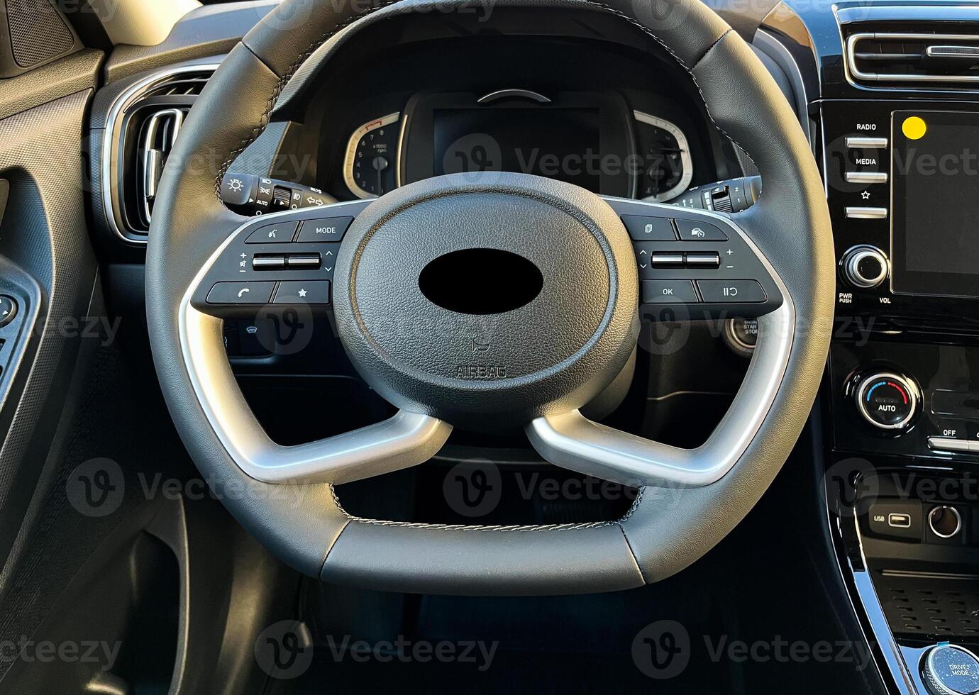 Interior of the car interior. Steering wheel, instrument panel, computer screen, automatic transmission photo