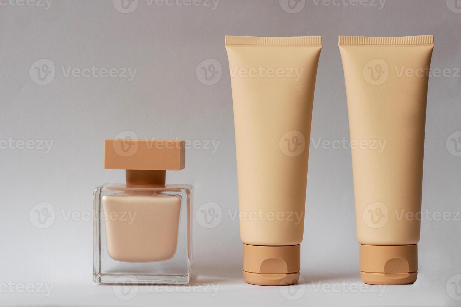 Close-up of a set of perfumed water, cream-colored shower gel in a gift box . Close-up photo on a white background
