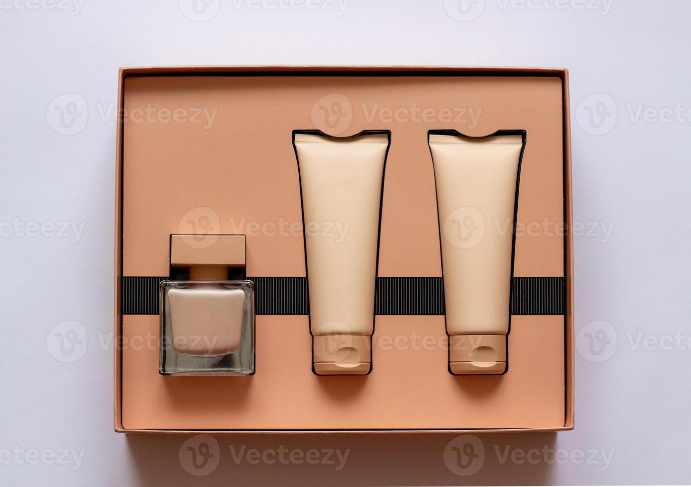 Close-up of a set of perfumed water, cream-colored shower gel in a gift box . Close-up photo on a white background