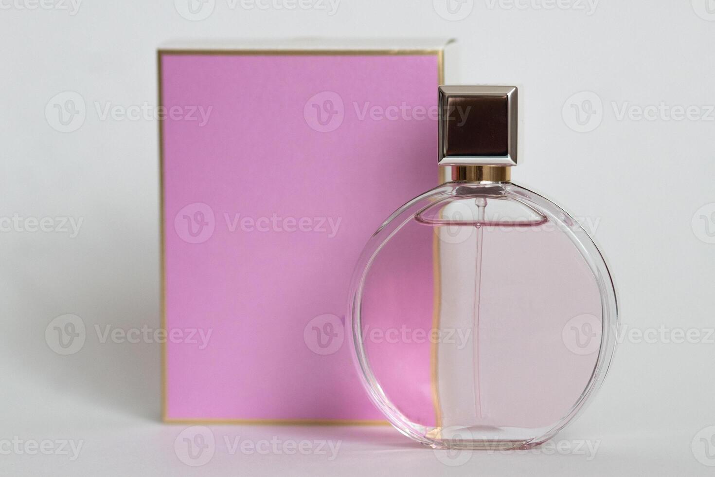 Perfume bottle from a pink box on an isolated background with mockup and copyspace photo