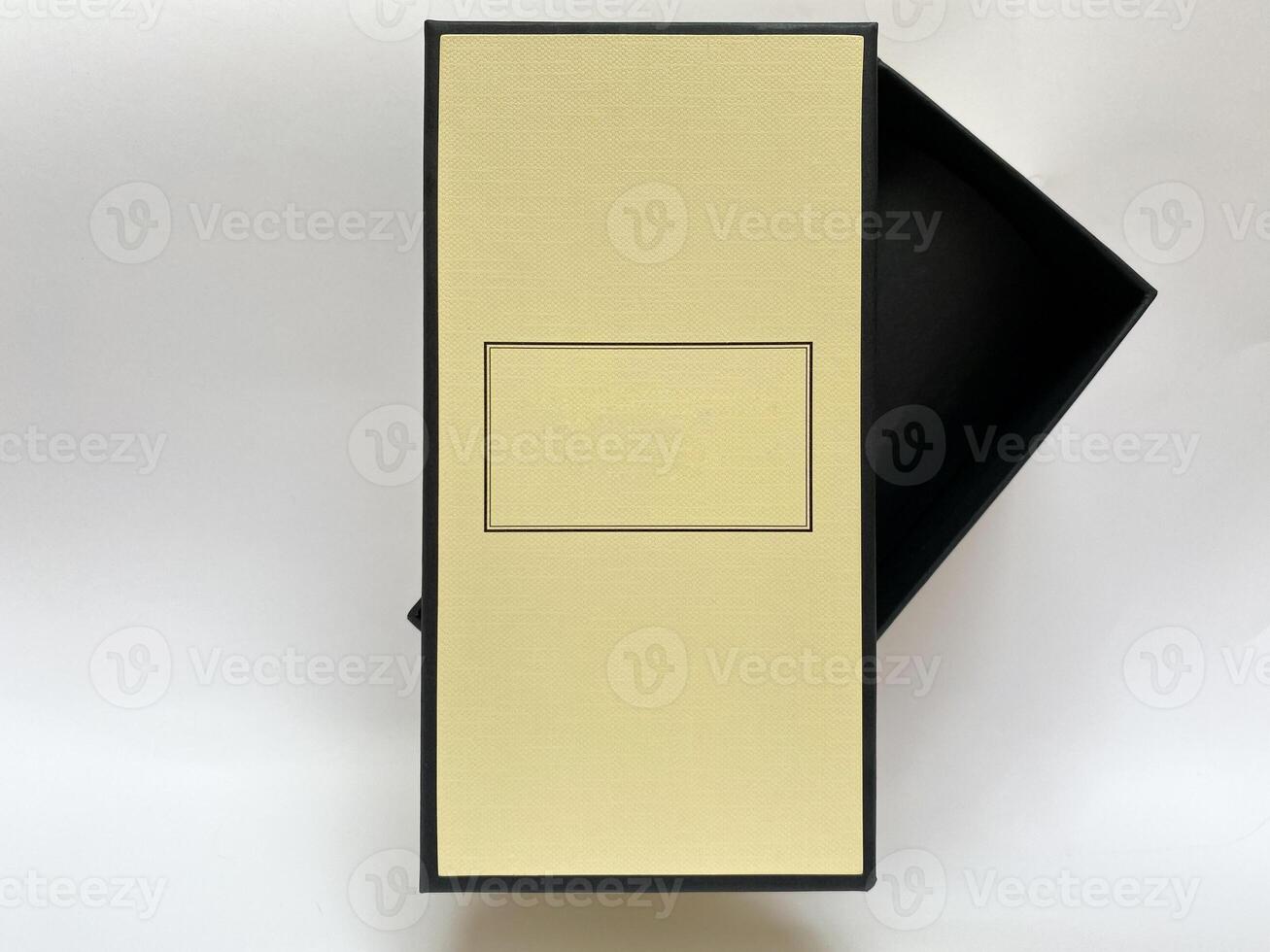 A bottle of perfume from a yellow box on a white isolated background photo