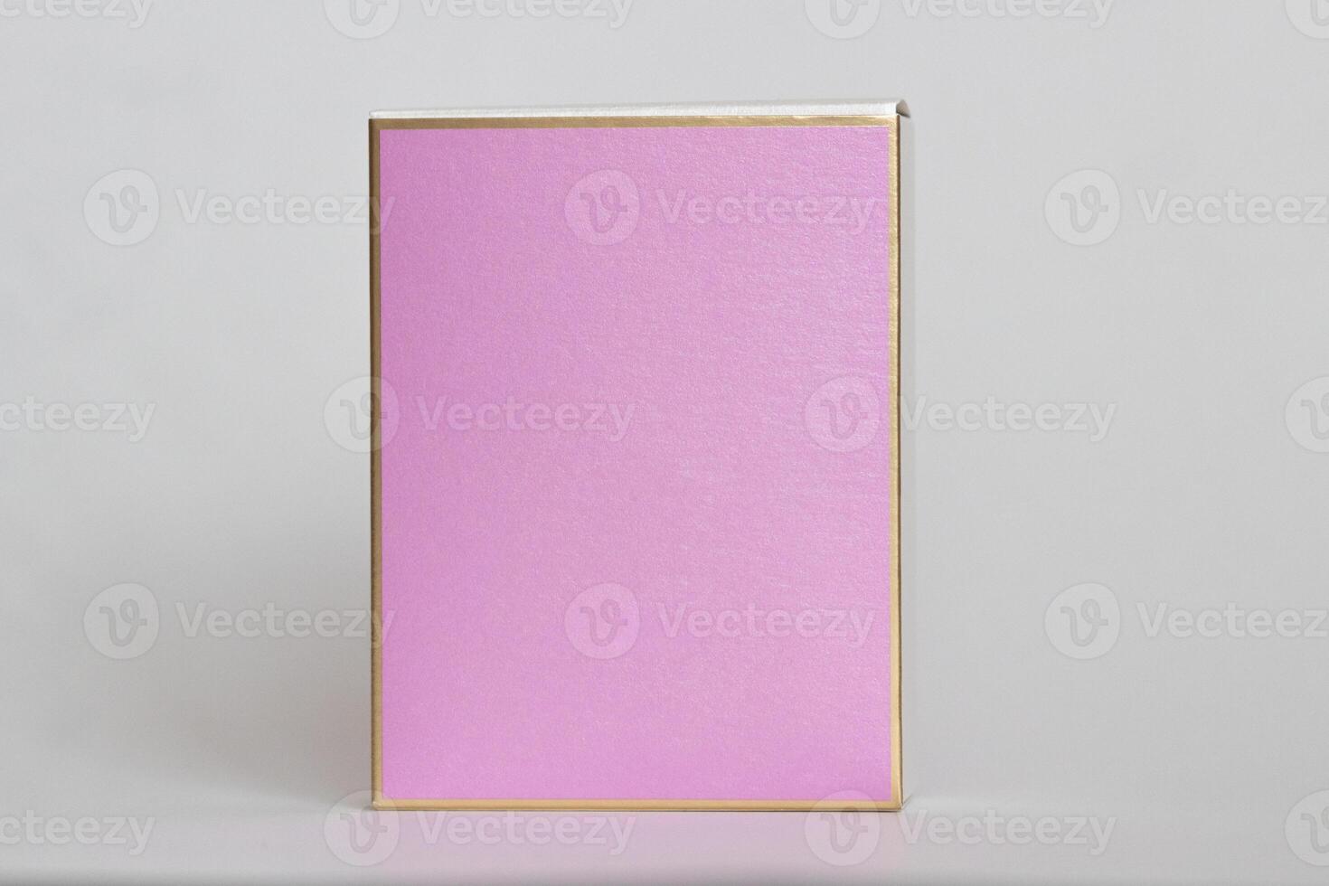 Perfume bottle from a pink box on an isolated background with mockup and copyspace photo