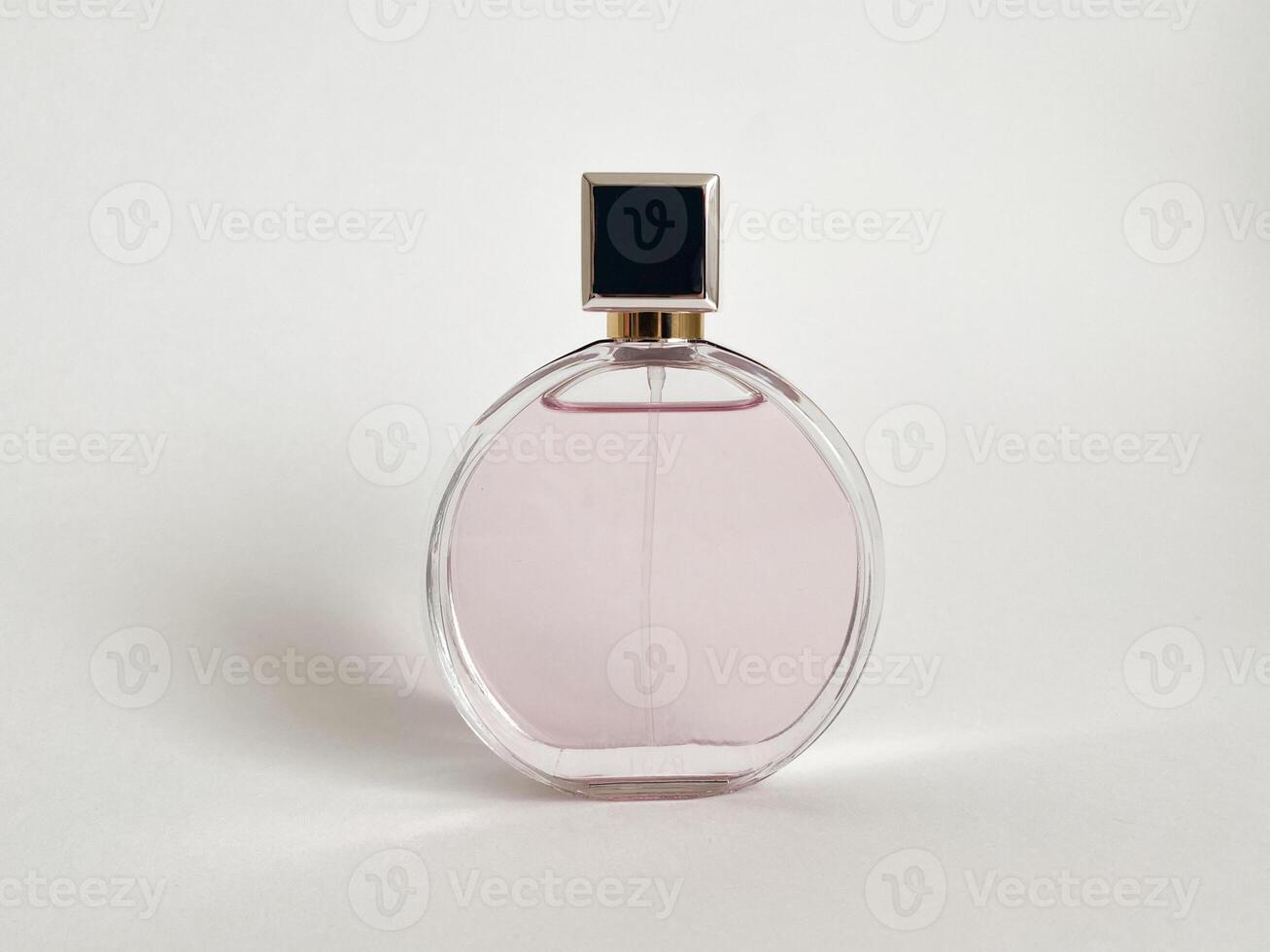 Perfume bottle from a pink box on an isolated background with mockup and copyspace photo