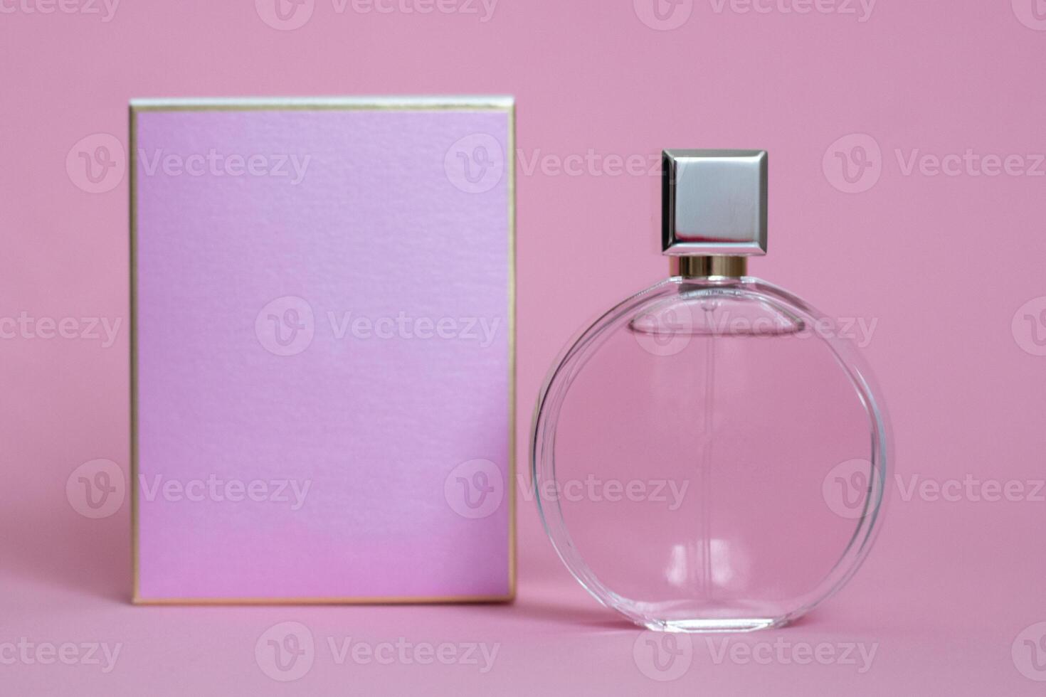Perfume bottle from a pink box on an isolated background with mockup and copyspace photo