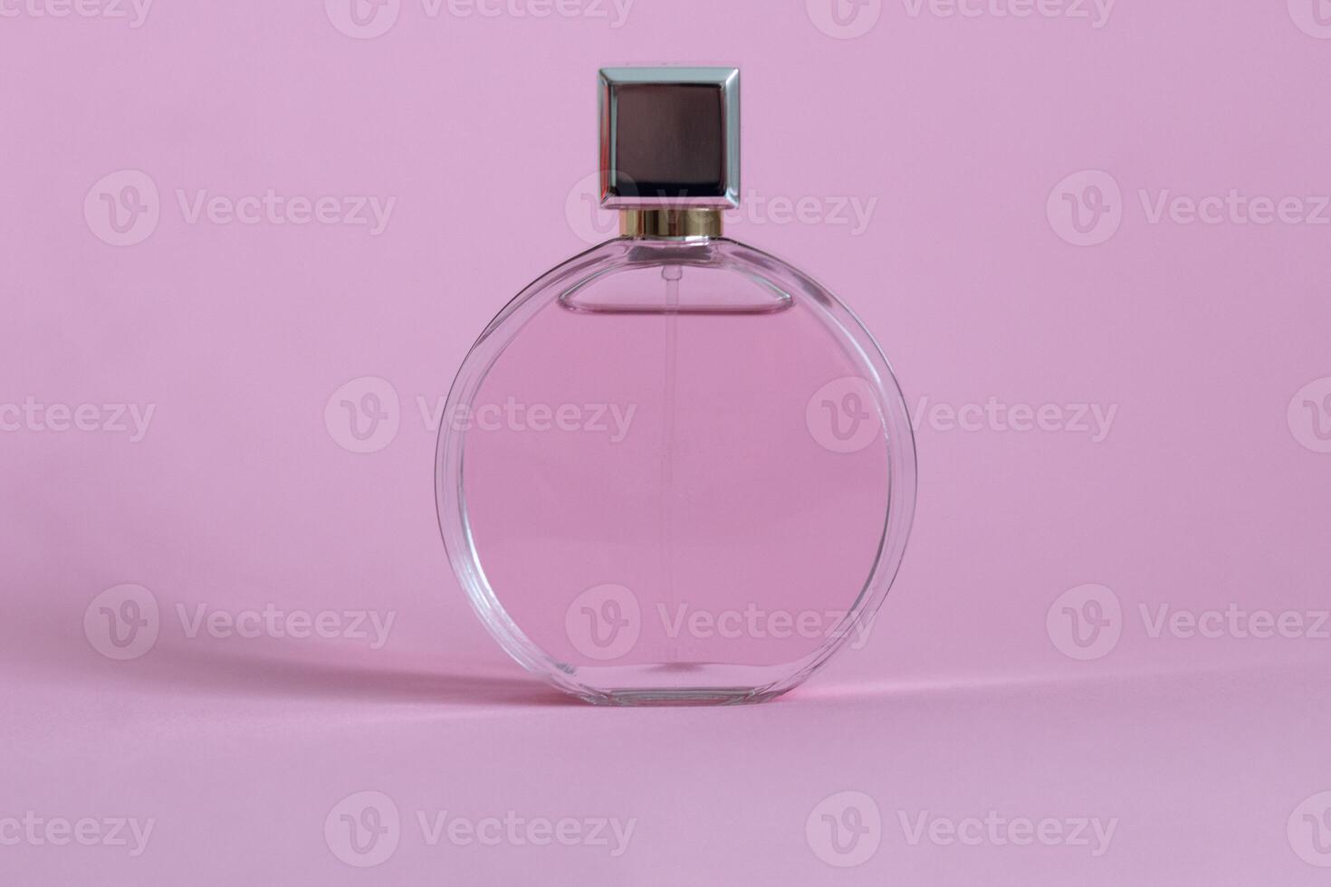 Perfume bottle from a pink box on an isolated background with mockup and copyspace photo