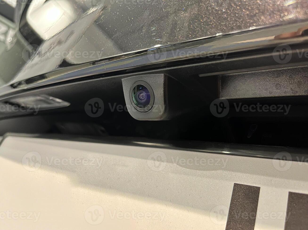 Rear view camera with washer installed on the car photo