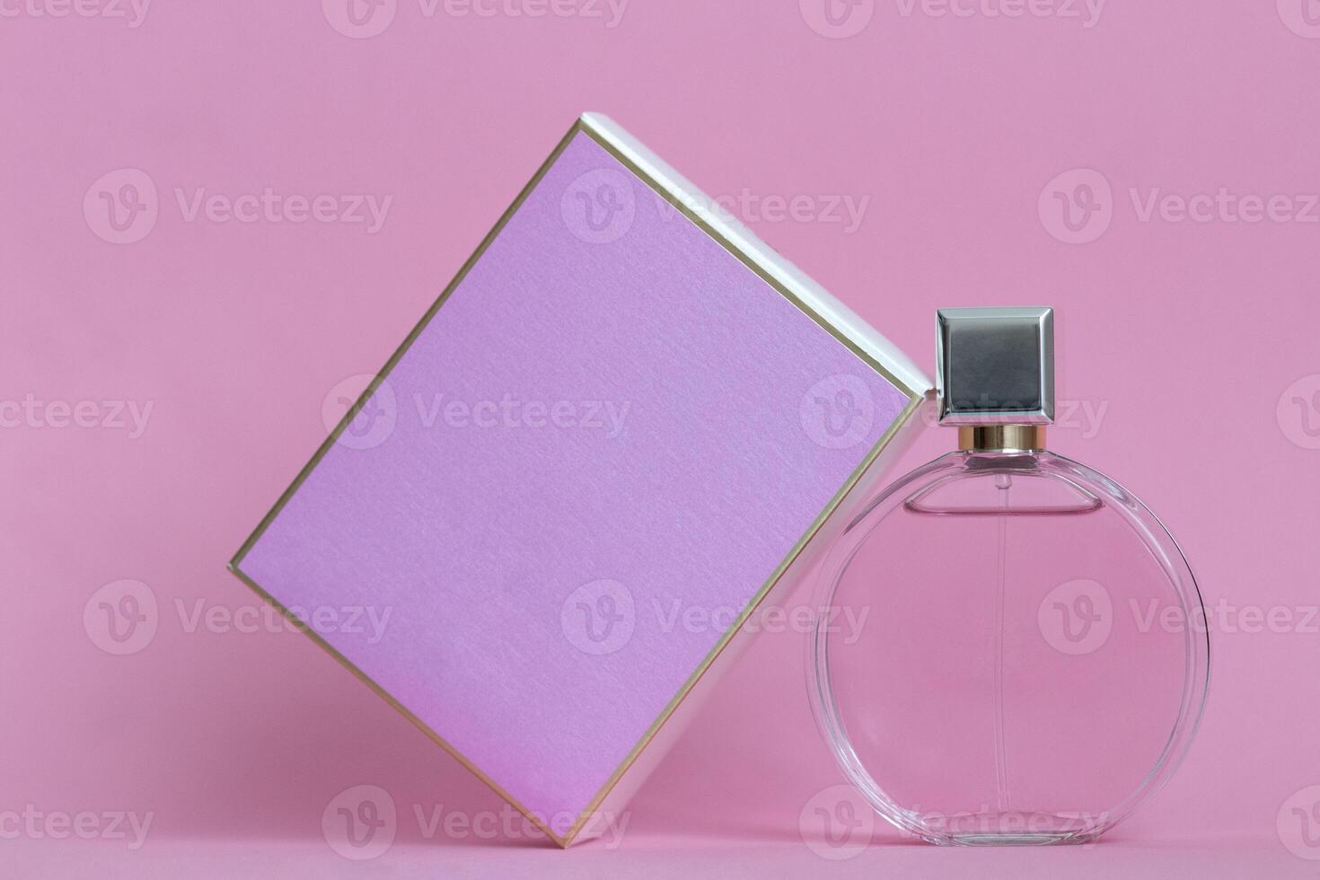 Perfume bottle from a pink box on an isolated background with mockup and copyspace photo