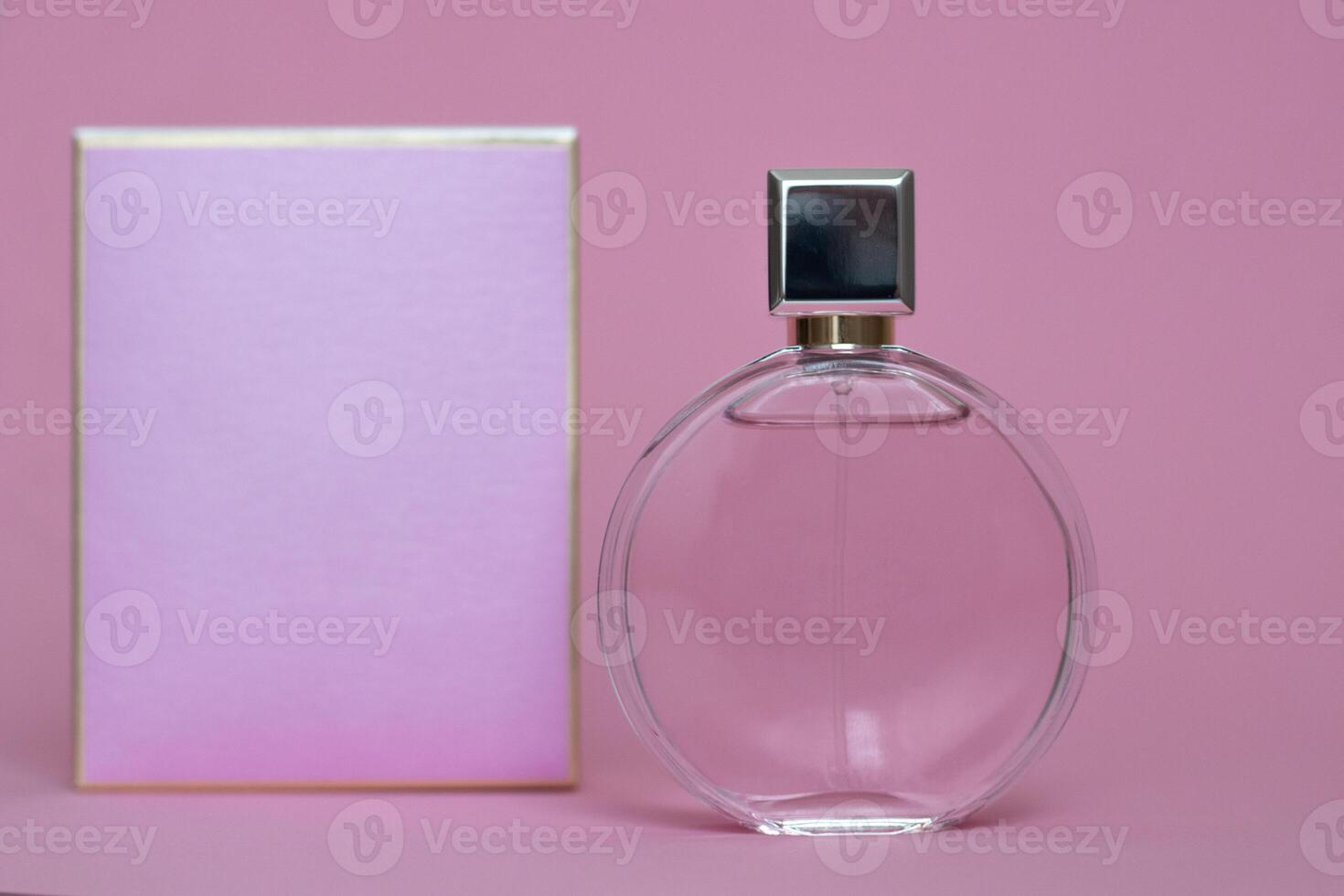 Perfume bottle from a pink box on an isolated background with mockup and copyspace photo