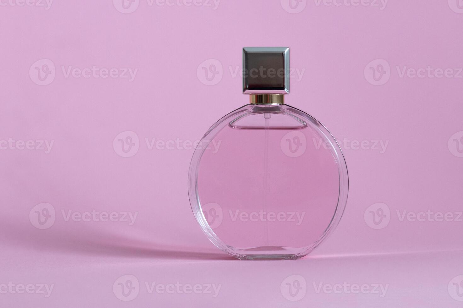 Perfume bottle from a pink box on an isolated background with mockup and copyspace photo