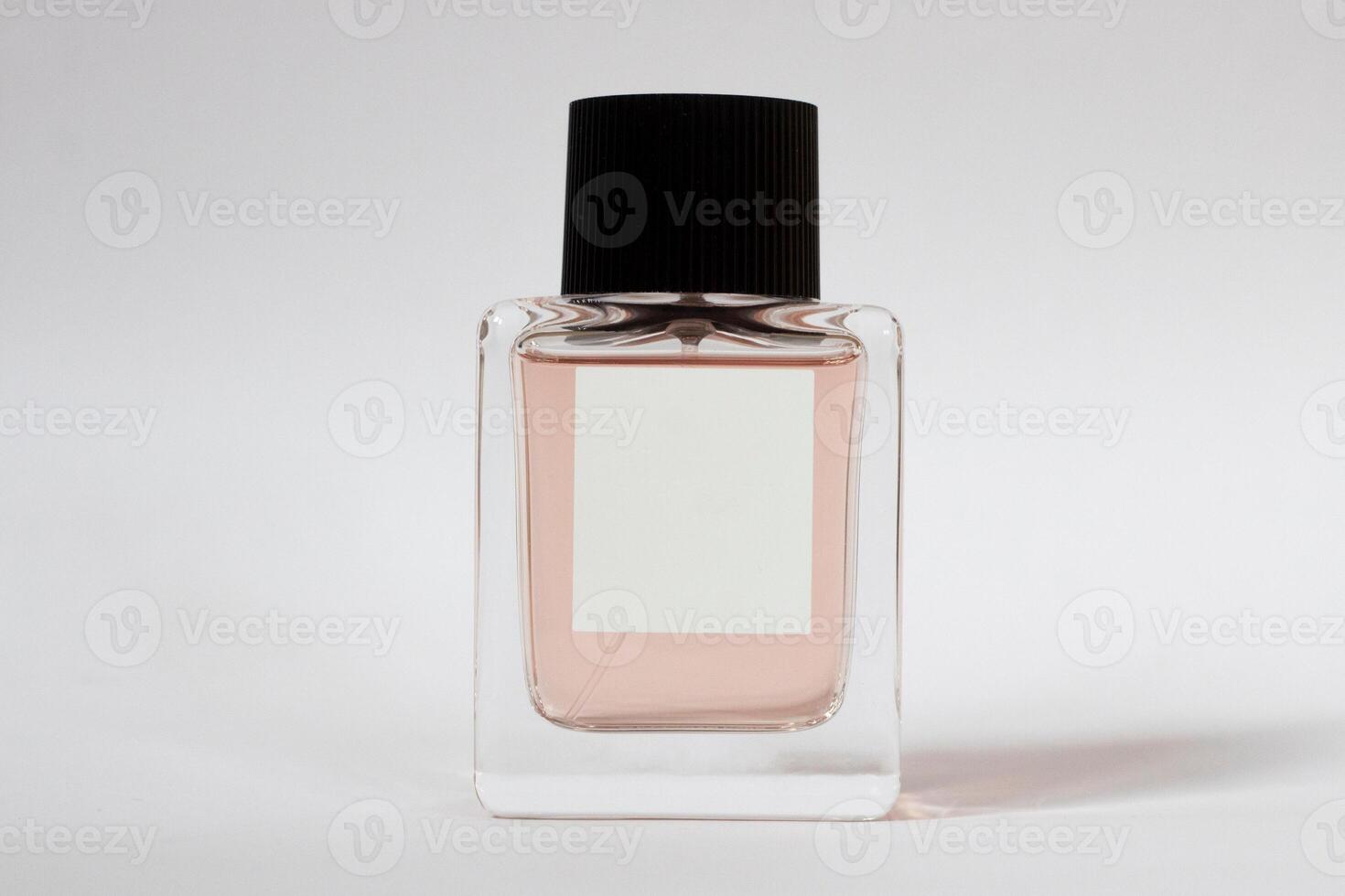 Elegant bottle of women's perfume close-up on an isolated background photo