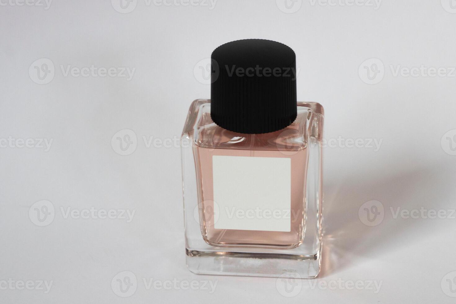Elegant bottle of women's perfume close-up on an isolated background photo