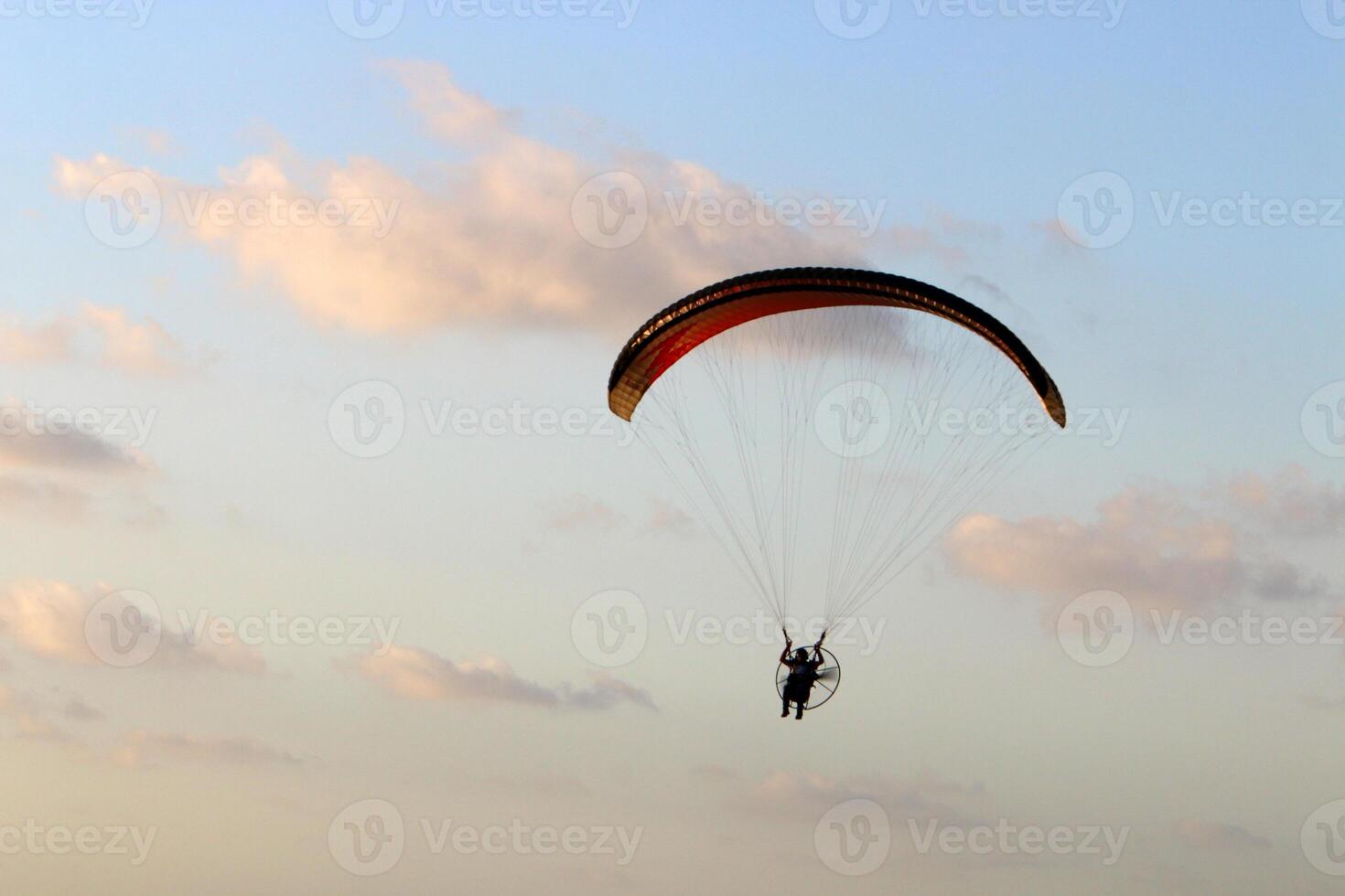 Flying on a wing over the Mediterranean Sea photo