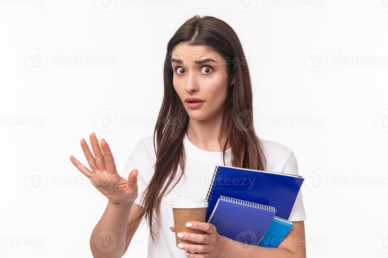 Education, university and studying concept. Wow come down, slow for minute. Close-up portrait of freaked-out shocked young female student saying stop, chill gesture, look concerned hold notebook photo