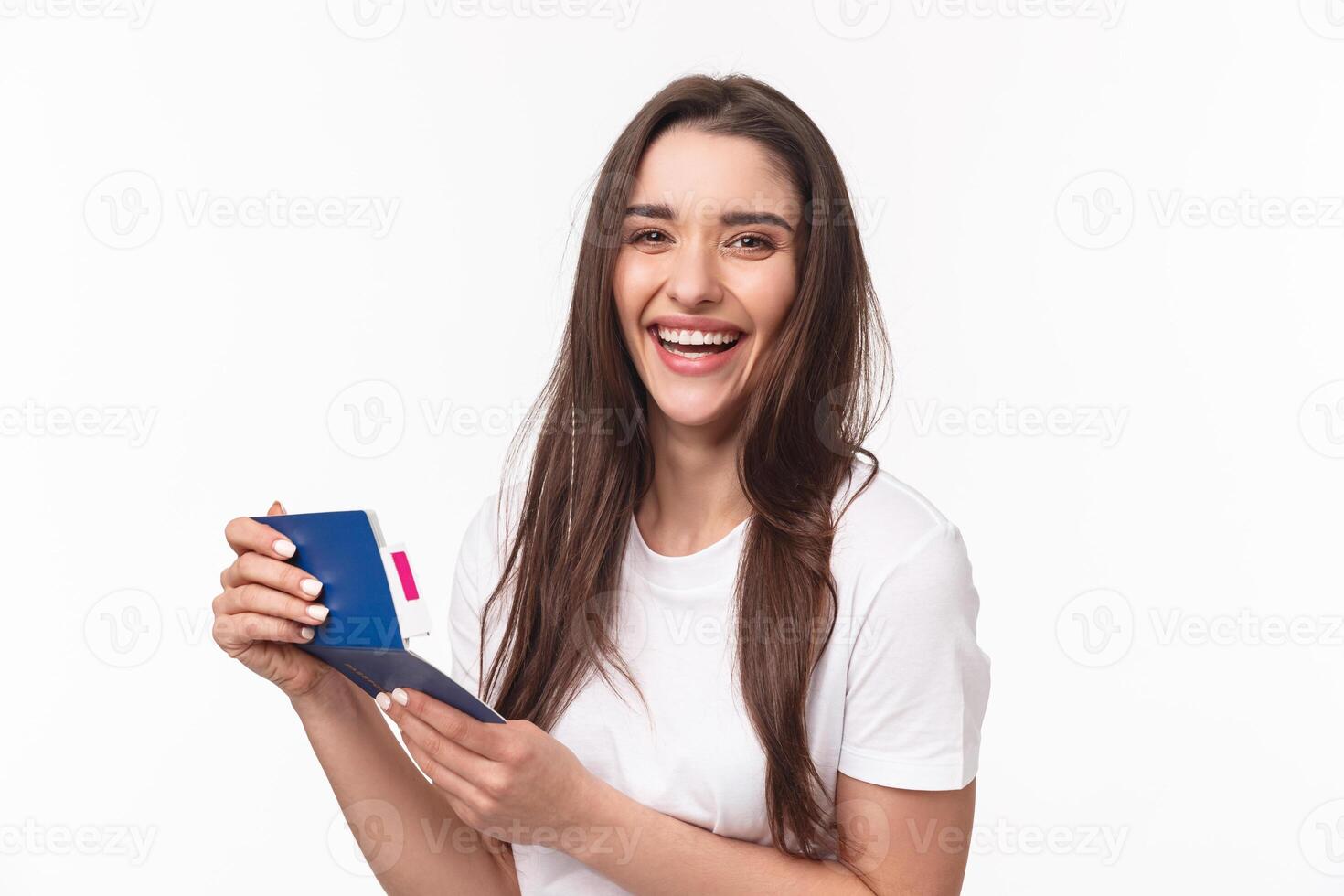Travelling, holidays, summer concept. Close-up portrait of happy, charismatic pretty woman laughing, looking at her visa in passport with plane ticket, smiling joyful camera, ready for journey photo