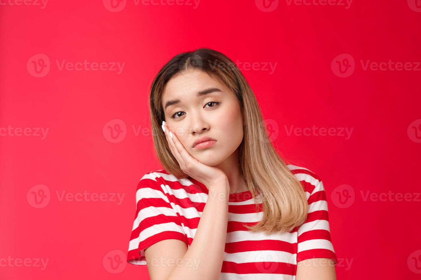 Close-up tired girl express apathy boredom, sighing reluctant look camera lean face palm falling asleep, feel boring listening uninteresting lecture, stand red background displeassed photo