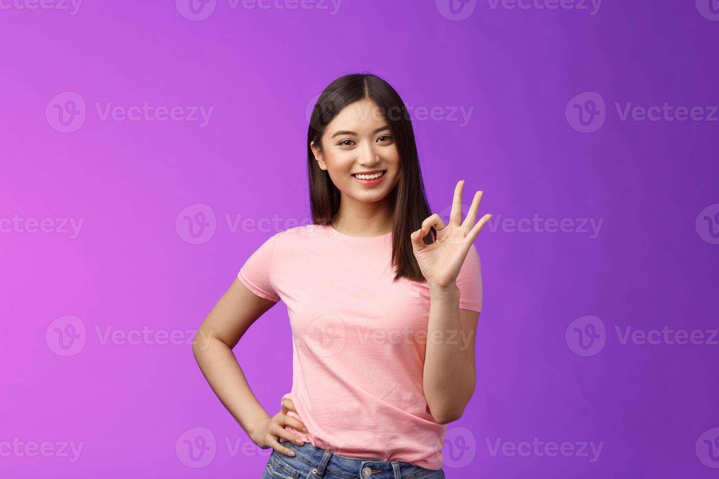 Okay good choice. Tender attractive friendly asian girl shopping together girlfriend, give positive reply, accept good idea, show ok sign, smiling judgemental, approve perfect plan photo