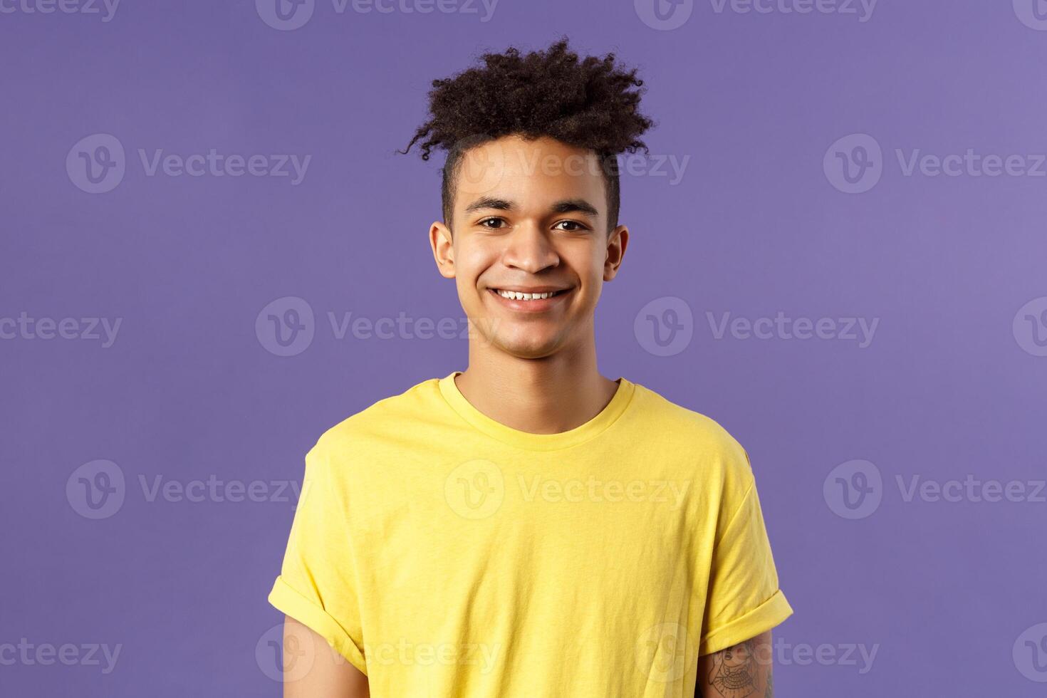 Close-up portrait of smiling, enthusiastic hispanic male student searching job, consider career opportunities, recruiting to company, smiling cheerful standing purple background photo