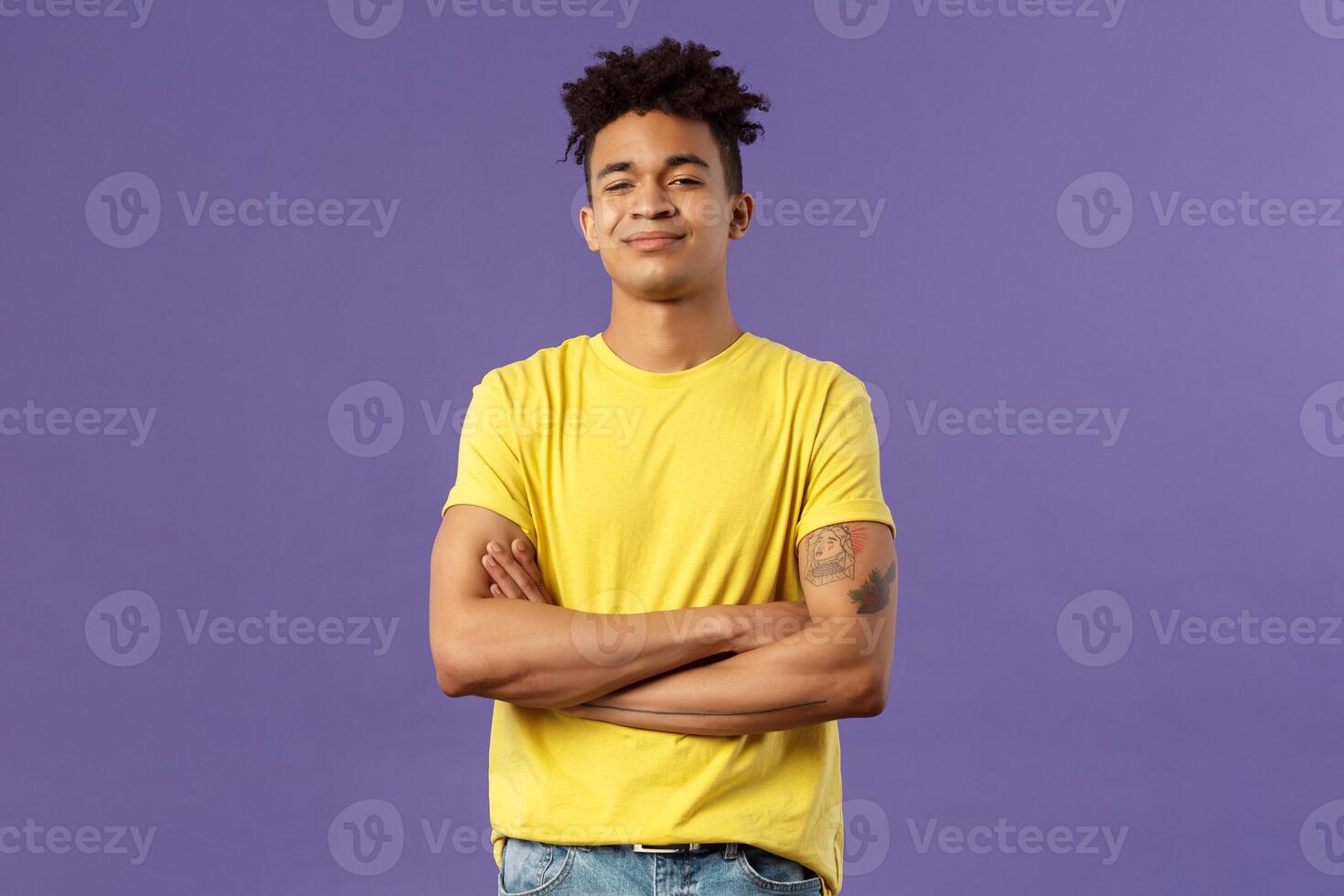 Close-up portrait of arrogant, proud and boastful young smart guy cross hands over chest in confident, self-assured pose, smirk and look mighty, feel like he knows everything, purple background photo