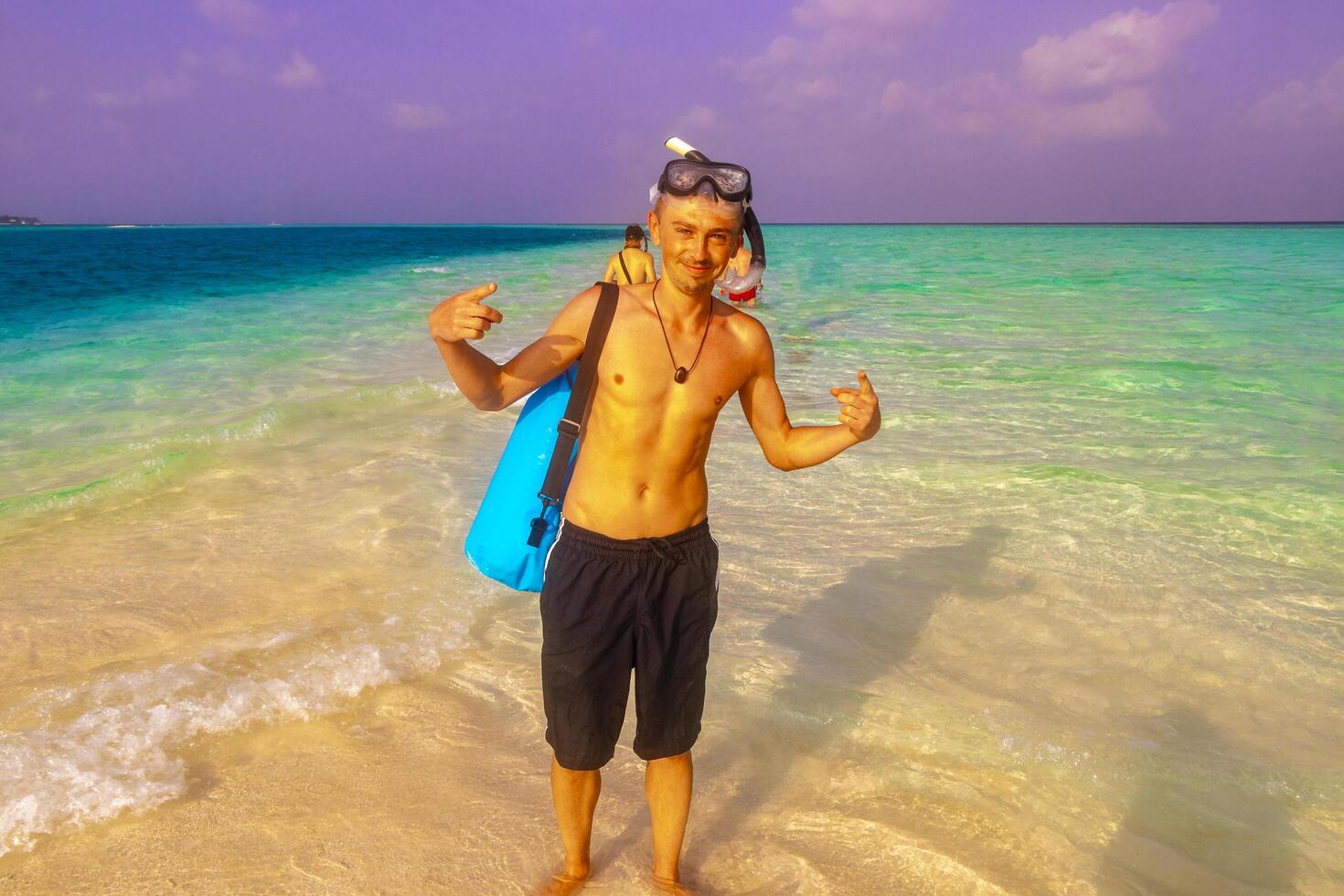 Man with snorkeling equipment fins and snorkeling mask Maldives. photo