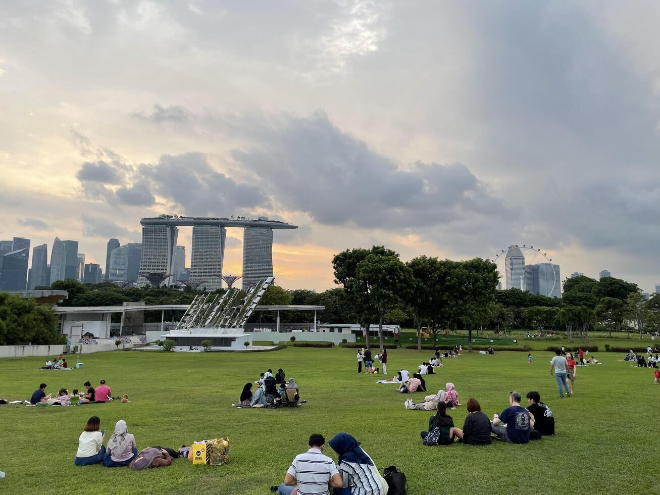 Singapore - July 13rd, 2024 Many People enjoying and playing at Marina Barrage. Marina Barrage is the water-supply place of Singapore and is the park for outdoor activities of Singapore people photo