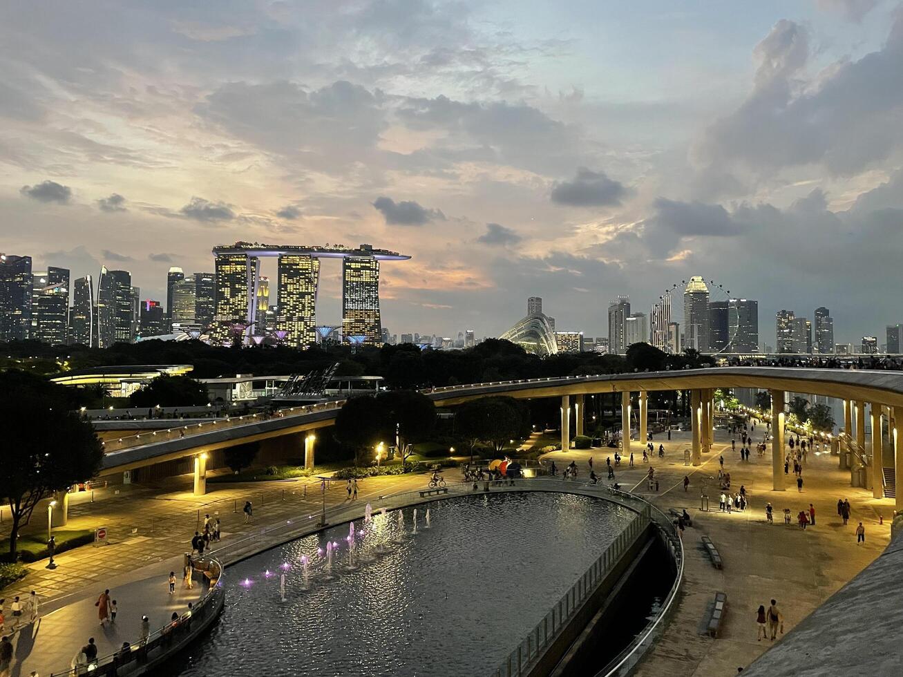 Singapore - July 13rd, 2024 Many People enjoying and playing at Marina Barrage. Marina Barrage is the water-supply place of Singapore and is the park for outdoor activities of Singapore people photo