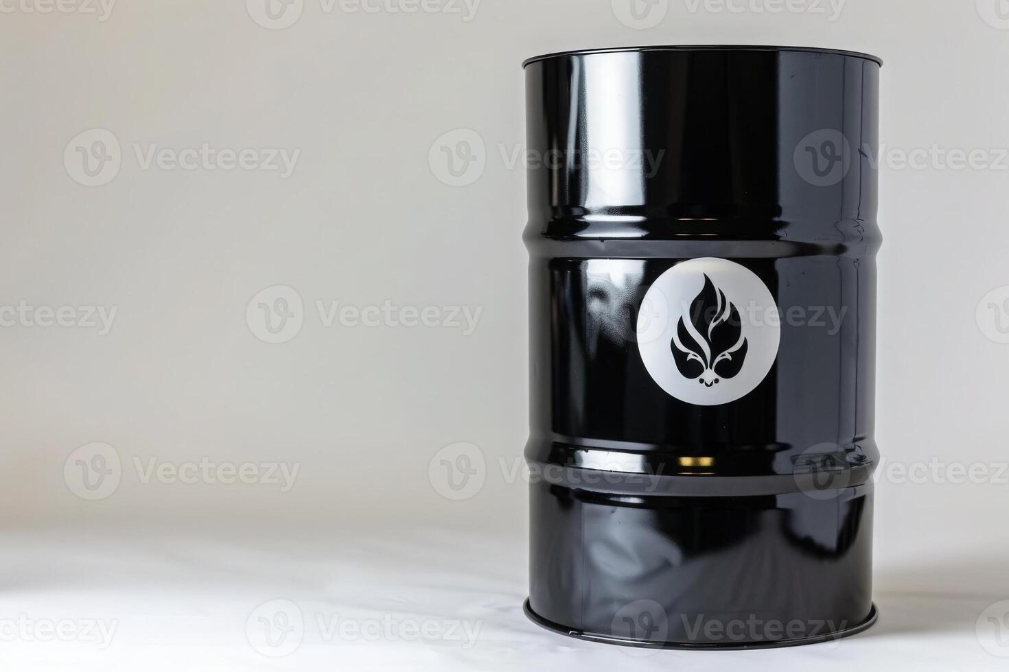 An isolated black oil drum features a striking logo, elegantly positioned against a neutral background, inviting curiosity. photo